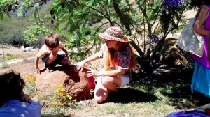 herbalist Julie James working with children out in the field 