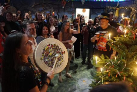 A group of people around a tree