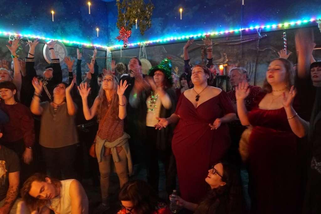 A group of people in a room with lights